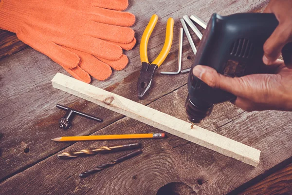 Wooden workshop table with tools.