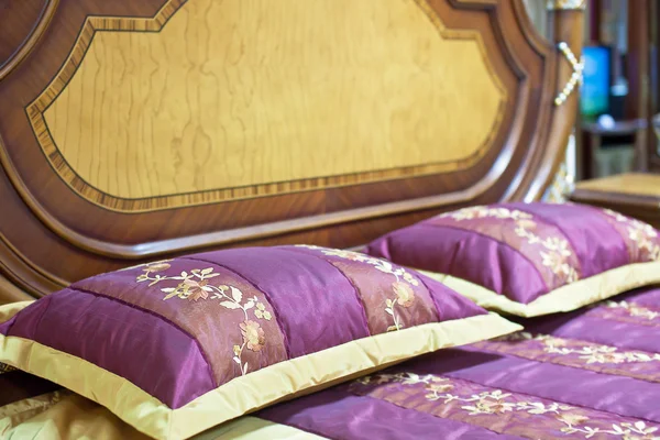 Part of a double bed with decorative headboard