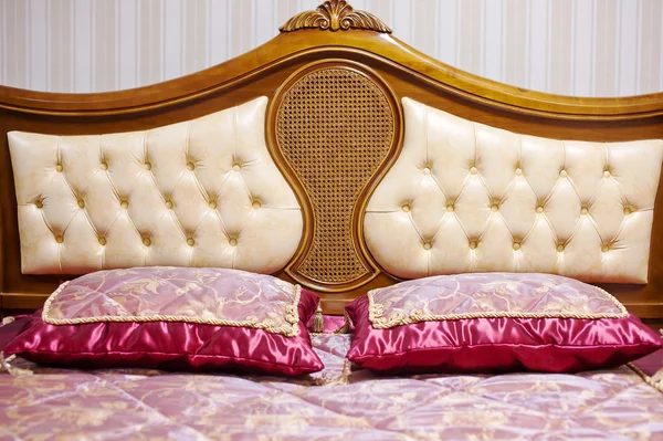 Double bed with decorative headboard