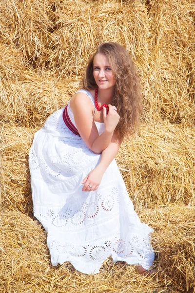 Portrait of a beautiful young woman dressed in country style
