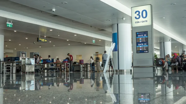 Airport hall with people in security checkpoint. Hanoi, Vietnam