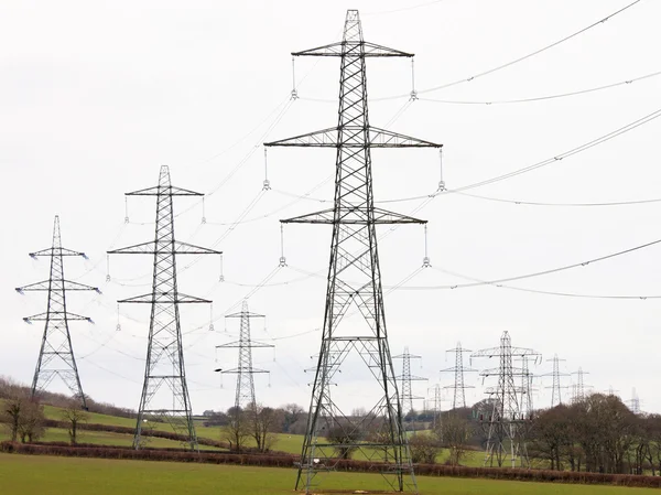 Pylons astride the countryside in Devon UK