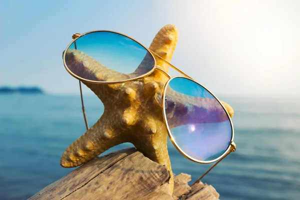 Starfish in a sun glasses symbol of happy ocean rest