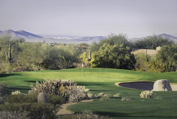 Beautiful desert tee shot golf course - image cross processed