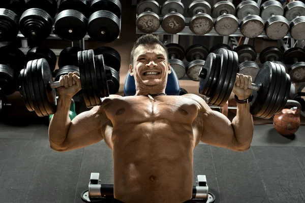 Bodybuilder with dumbbells