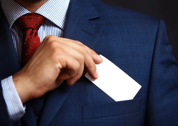 Businessman putting card