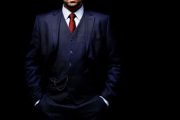 Man in suit on black background