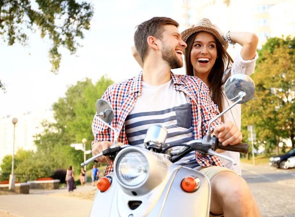 Young couple on scooter