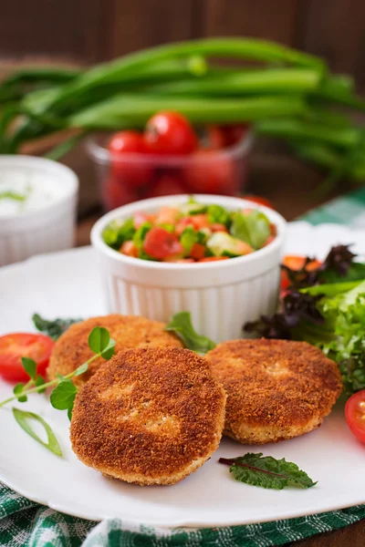 Small chicken cutlets with vegetables