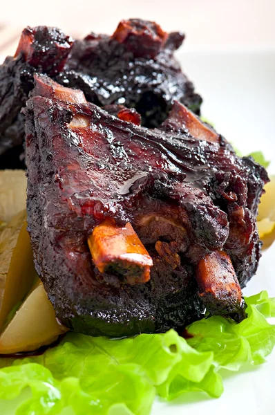 Baked beef ribs with  vegetables