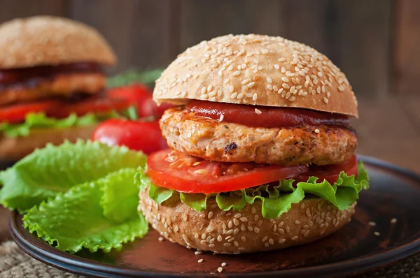 Sandwiches with chicken , tomatoes and lettuce