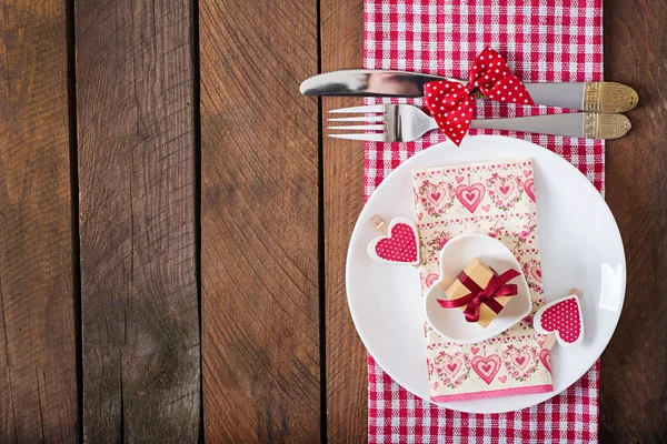 Romantic table setting for Valentines day in a rustic style.