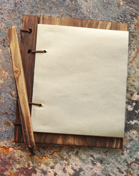 Paper notepad with pencil