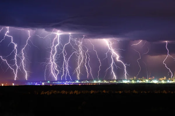 Night thunder lightning over city