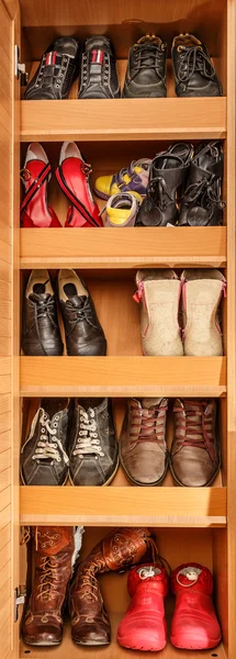 Different shoes on shelves
