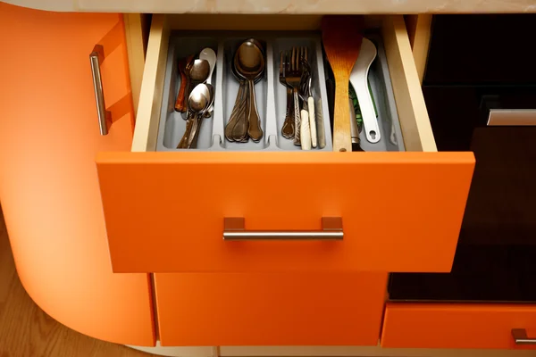Orange wooden kitchen drawers