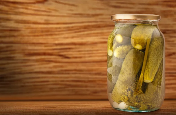 Pickled cucumbers on wood