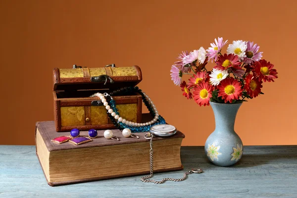 Flowers, books, jewelry box