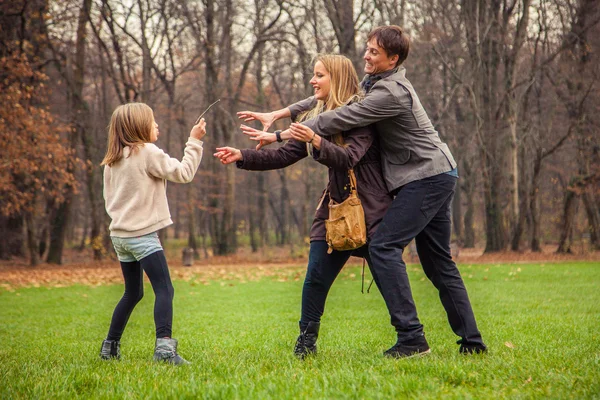 Family play around in park