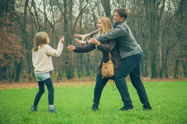 Family playing in park