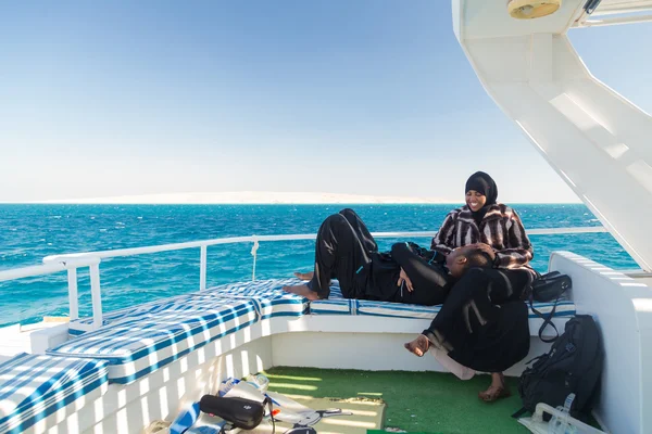 Couple on dive boat going snorkeling