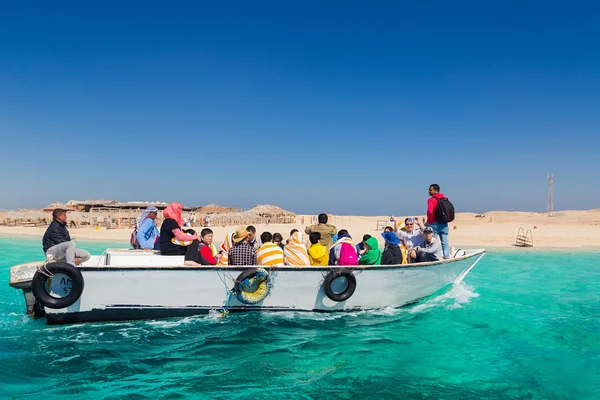 Tourists on dive boat going snorkeling