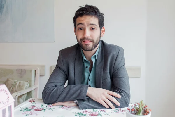 Young man sitting in restaurant