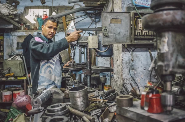 Indian mechanicIndian mechanic works in workshop