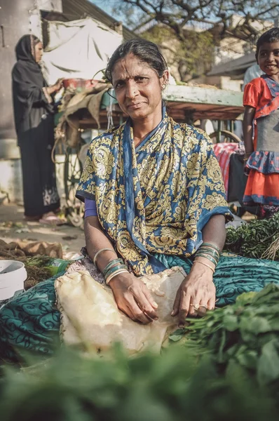 Indian lady sells vegetables