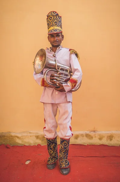 Musician holds trumpet
