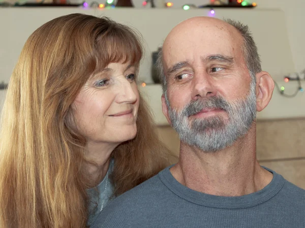 A Married Couple with Christmas Lights Behind