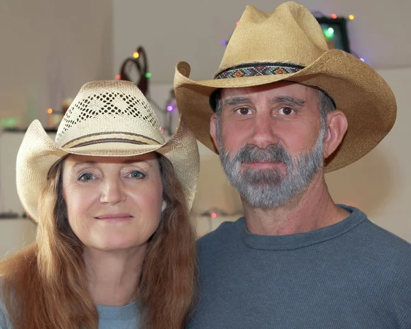 A Married Couple with Christmas Lights Behind