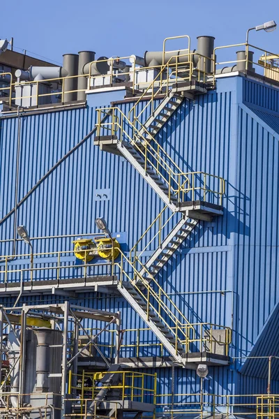 Metal stairs and pipes for industrial building