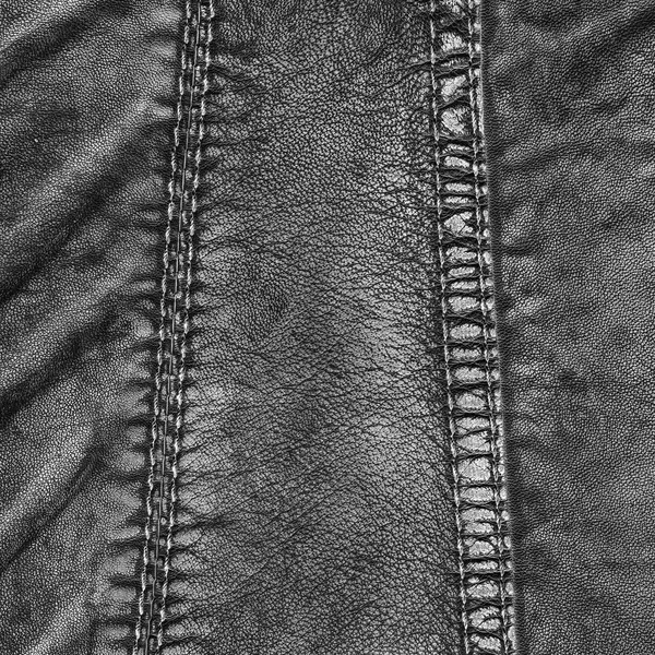 Fragment of black leather coat