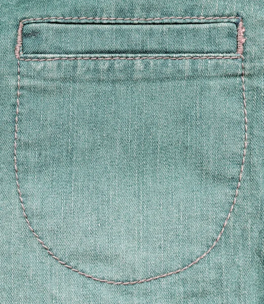 Fragment of female green denim trousers