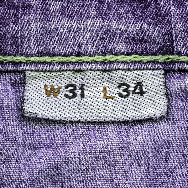 Violet jeans texture, textile label, size