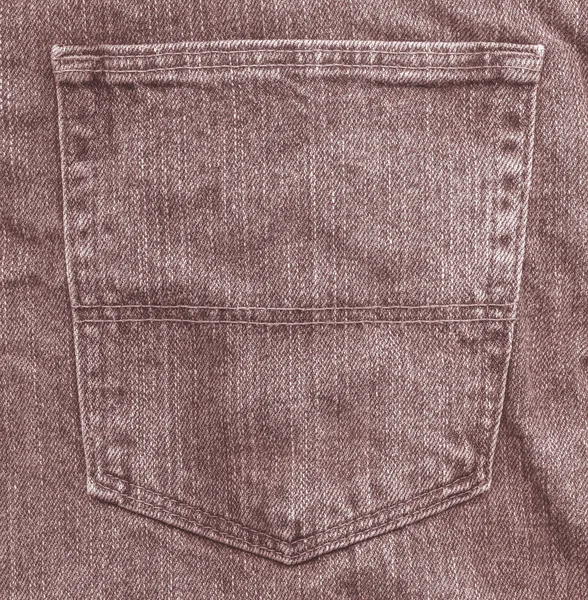Red-brown jeans pocket on jeans background