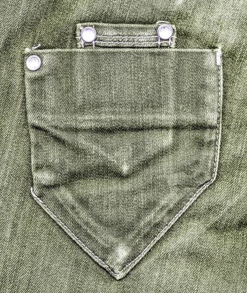 Gray-green jeans pocket on jeans background