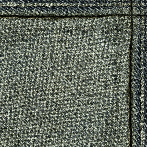 Old and worn blue-gray denim texture, seams