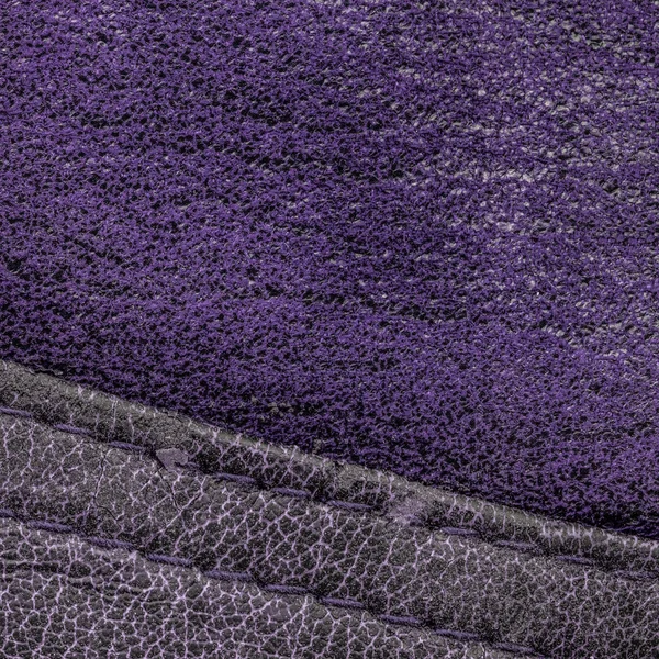 Violet background of two kinds of leather,seams
