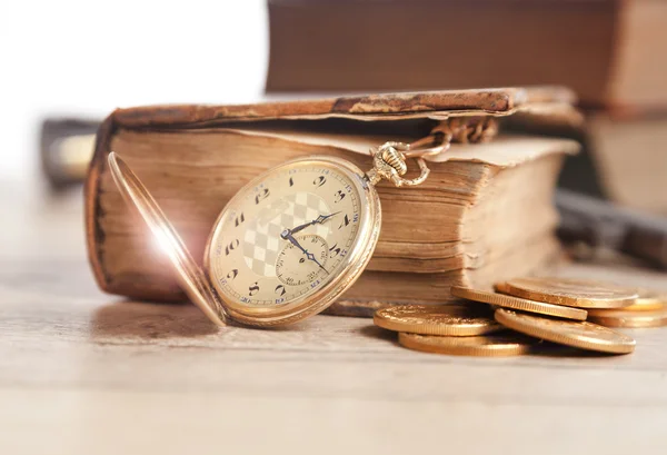 Golden pocket watch and law book