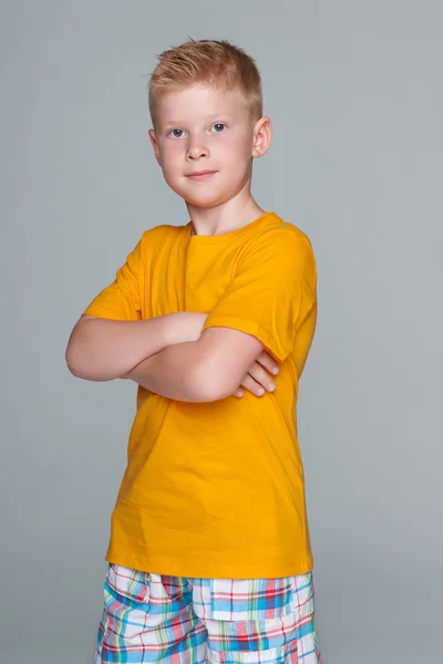 Young boy in a yellow shirt