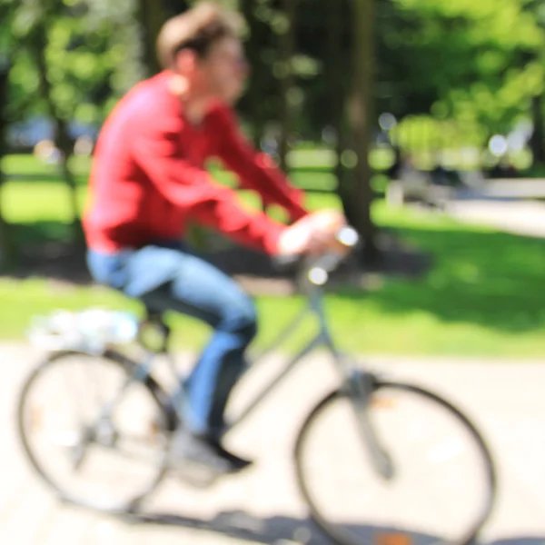 Unrecognizable blurred man on  bike