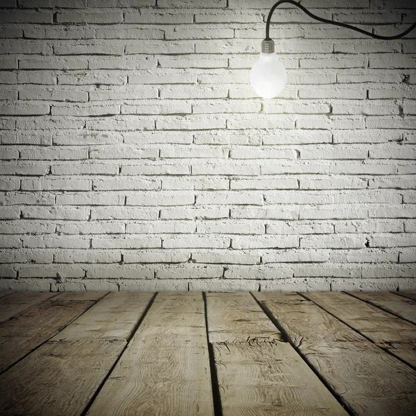 Industrial interior with wooden floor and brick white wall and bulb light on the roof
