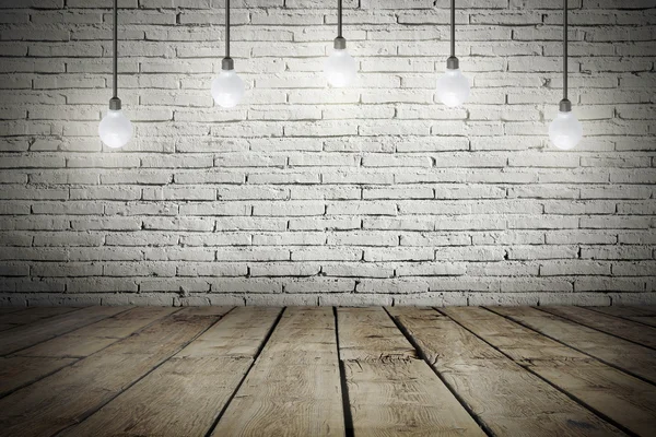 Industrial interior with wooden floor and brick white wall and bulb light on the roof