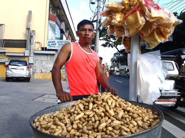 A food vendor peddles steamed peanuts in the streets of Antipolo City, Philippines.