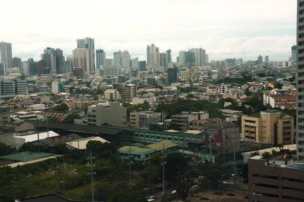 Aerial view of a commercial and residential area in Makati City.