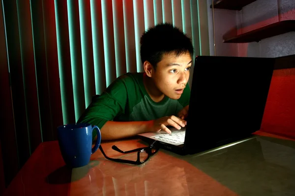 Young Teen in front of a laptop computer