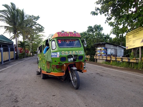 A motorcycle fitted with additional wheels and a cab is turned into what is called a tricycle. A means of transportation for most locals in the province of Samar, Philippines.