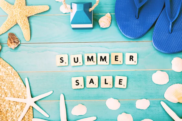 Wood Blocks on a Table for Summer Sale Concept
